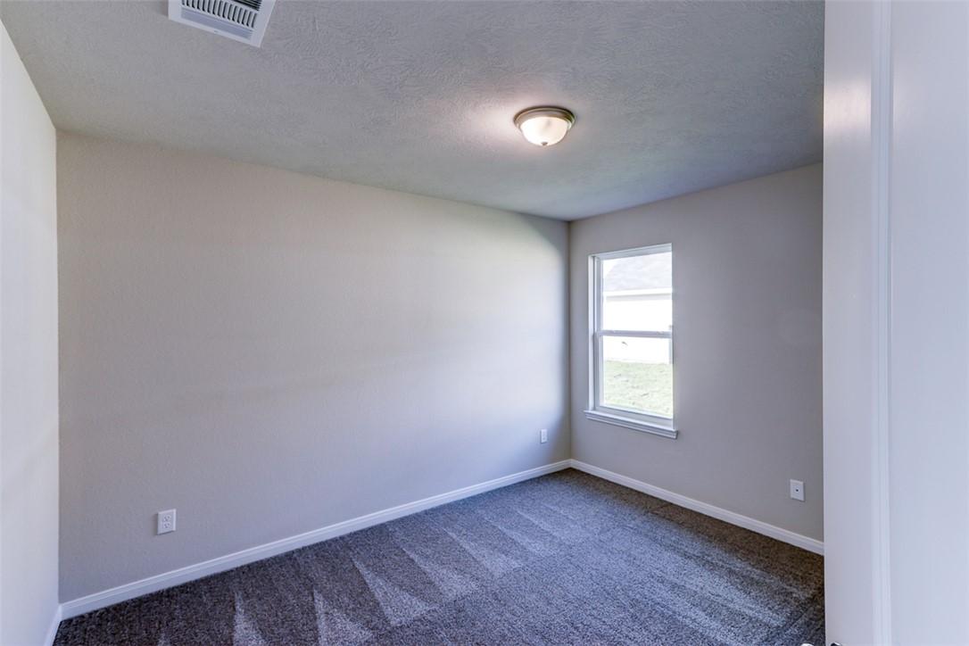 1937 Viva Road Bryan, TX 77807 - Photo 12 of 25 an empty room with windows