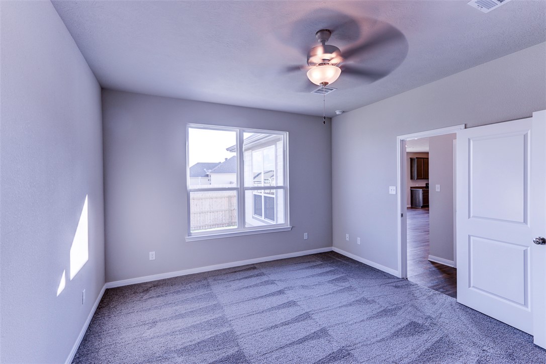 1937 Viva Road Bryan, TX 77807 - Photo 19 of 25 a view of an empty room with a window and wooden floor