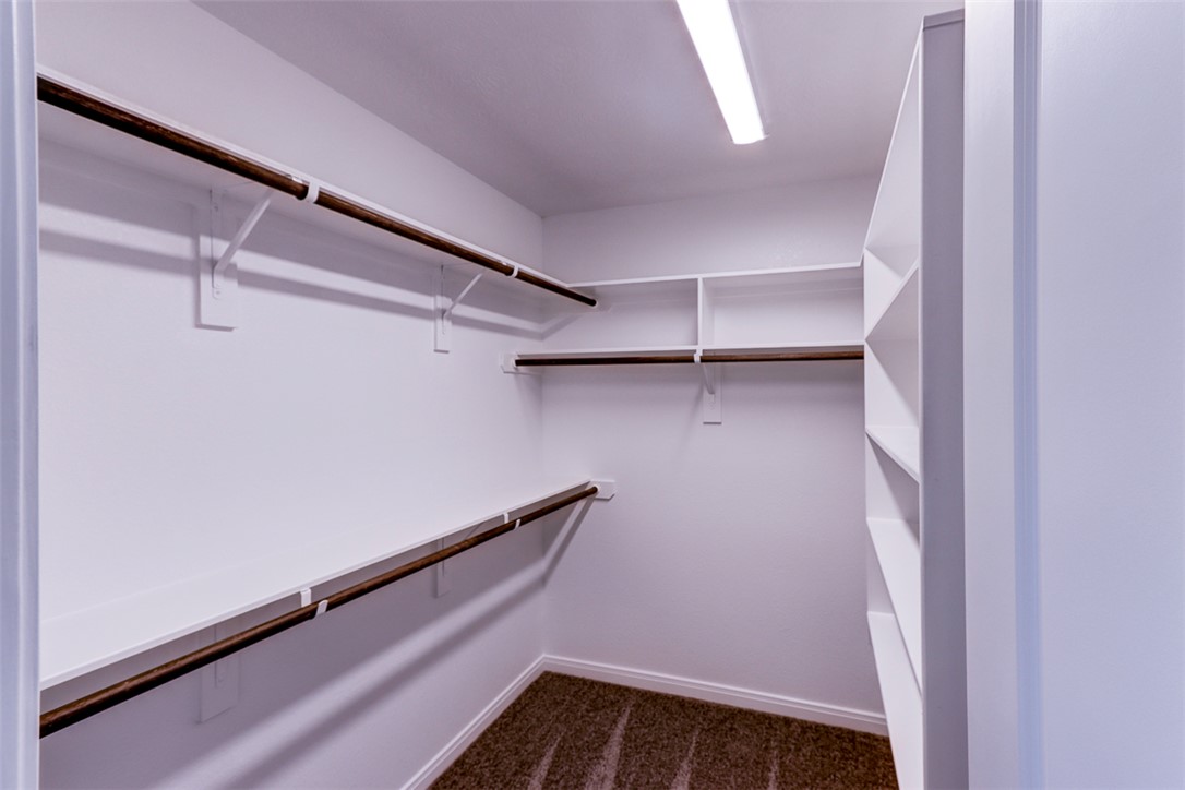 1937 Viva Road Bryan, TX 77807 - Photo 21 of 25 a view of walk in closet with empty racks