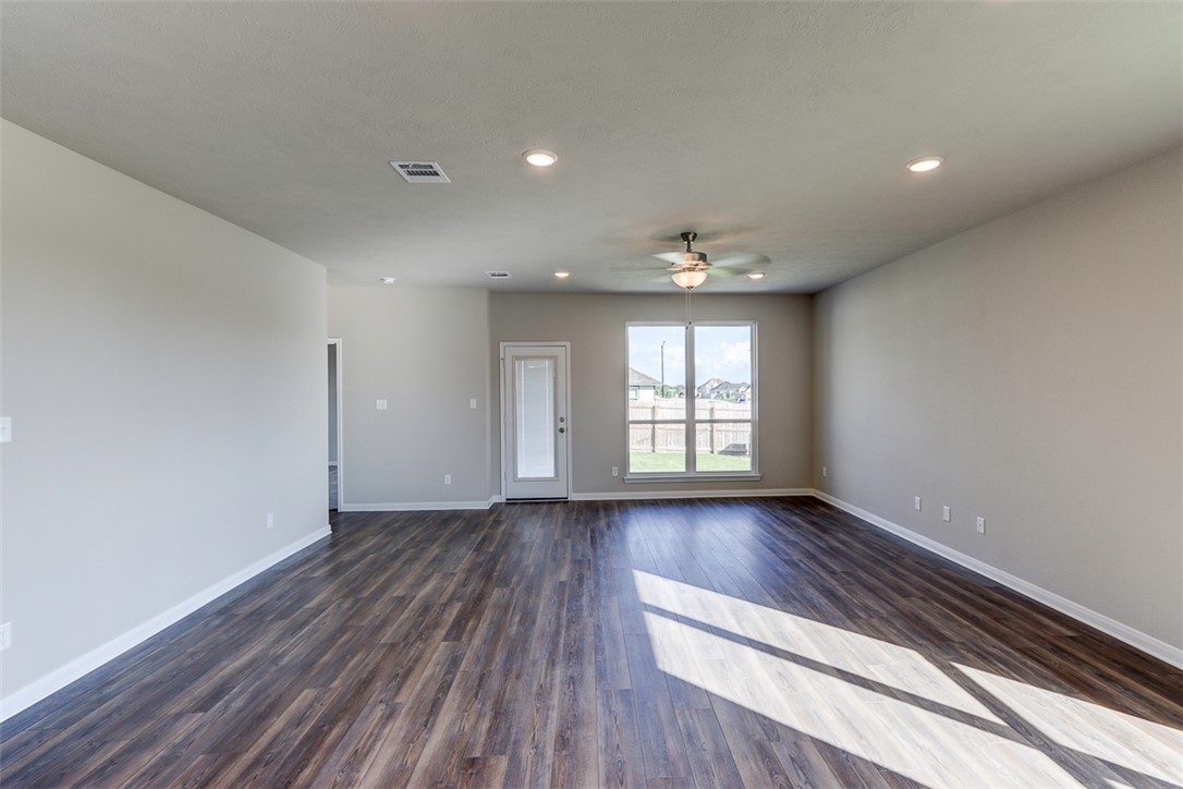 1937 Viva Road Bryan, TX 77807 - Photo 7 of 25 a view of an empty room with wooden floor and window