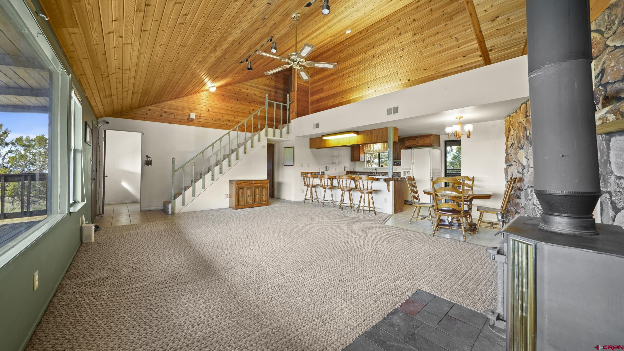 19617 Surface Creek Road Cedaredge, CO 81413 - Photo 3 of 34 a view of a livingroom with table and chair