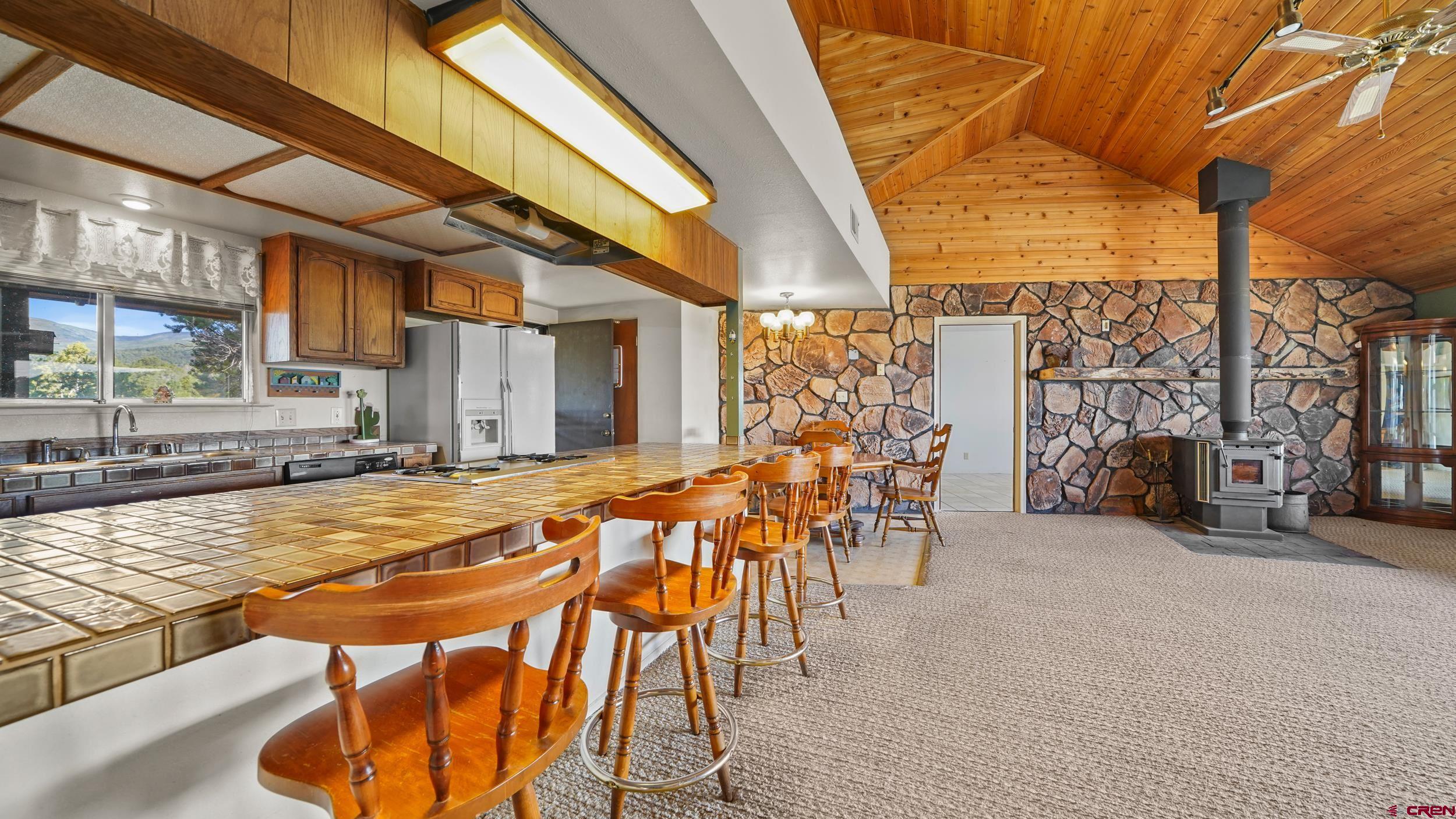 19617 Surface Creek Road Cedaredge, CO 81413 - Photo 5 of 34 a view of an chairs and tables in the patio