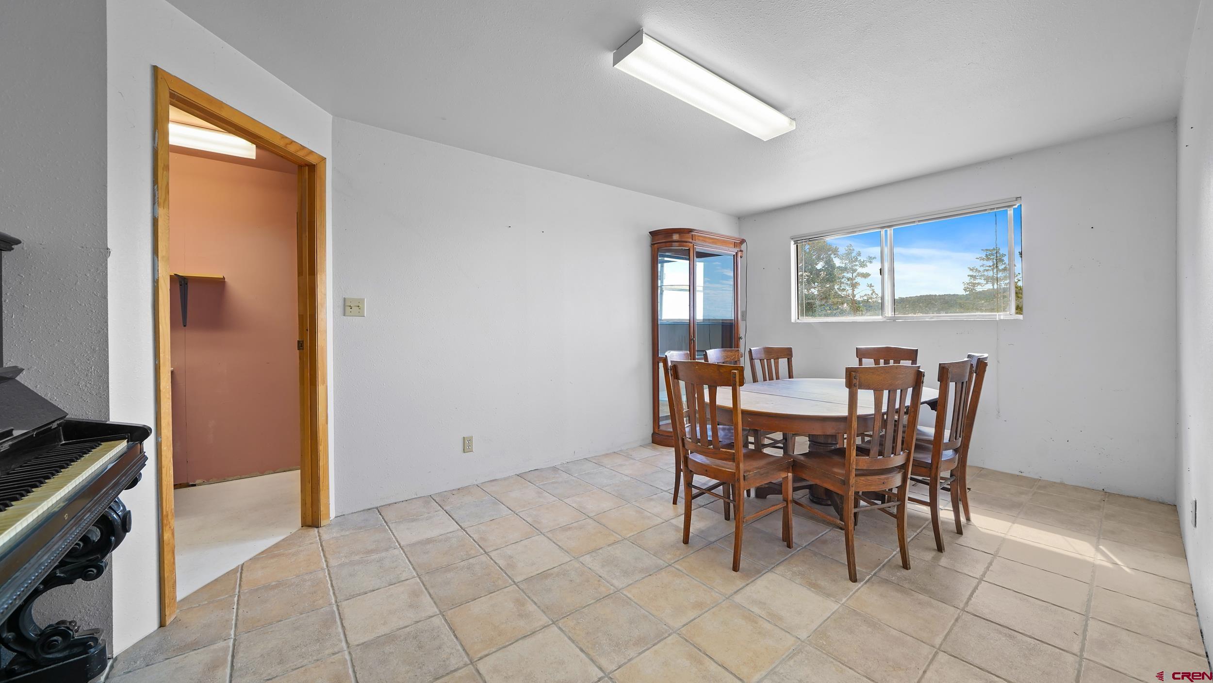 19617 Surface Creek Road Cedaredge, CO 81413 - Photo 9 of 34 a view of a dining room with furniture