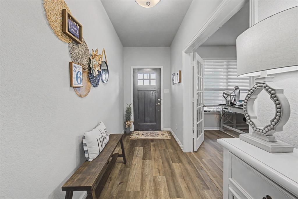 150 Oak Grove Drive Rhome, TX 76078 - Photo 3 of 40 a view of a hallway with workspace