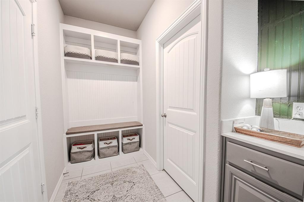 150 Oak Grove Drive Rhome, TX 76078 - Photo 33 of 40 a room with a bed and a lamp on table