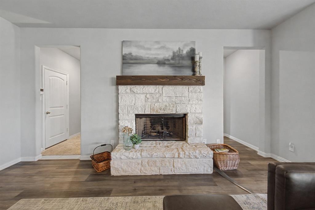 150 Oak Grove Drive Rhome, TX 76078 - Photo 7 of 40 a living room with furniture and a fireplace