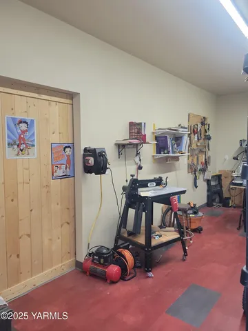 a room with furniture and gym equipment