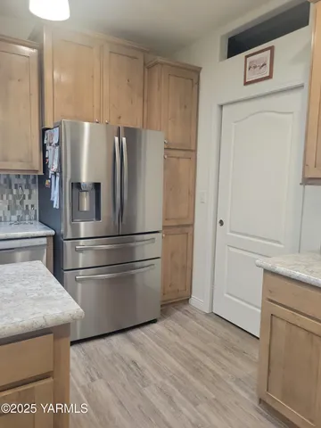 a bedroom with a bed and a night stand