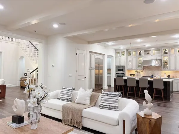 a kitchen with stainless steel appliances a refrigerator sink and stove
