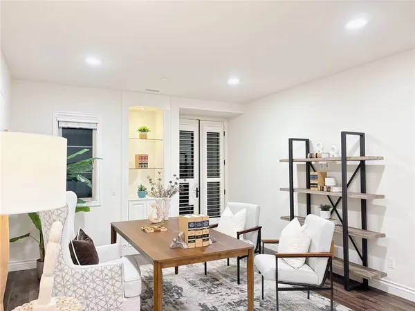 a bedroom with a bed and wall painting