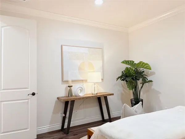 a view of an empty room with window and fire place