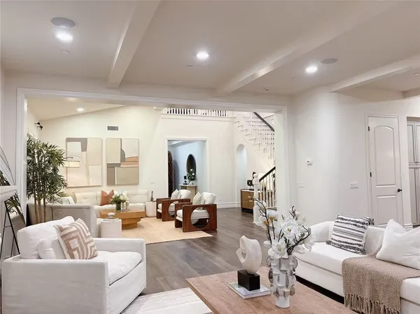 a living room with furniture and a table