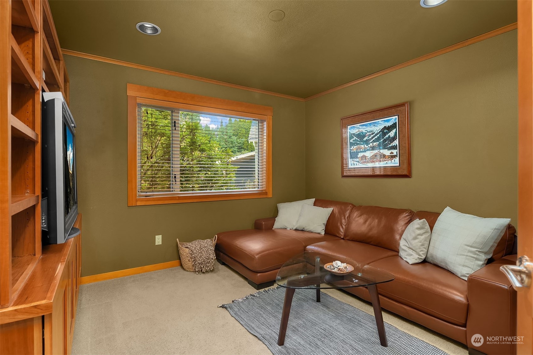 49 Strawberry Point Road Bellingham, WA 98229 - Photo 26 of 40 a blue couch sitting in a living room next to a window