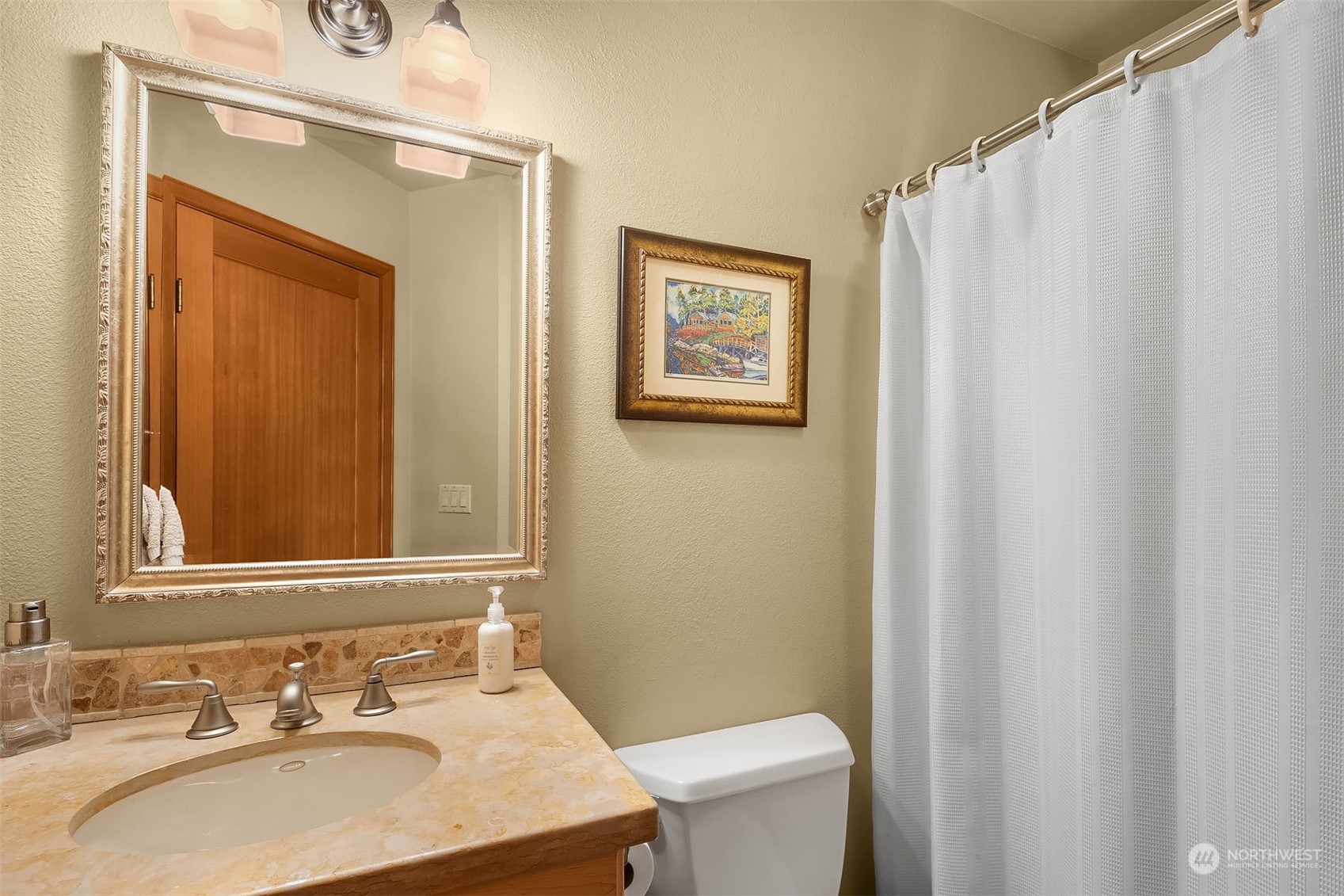 49 Strawberry Point Road Bellingham, WA 98229 - Photo 27 of 40 a bathroom with a sink and a mirror