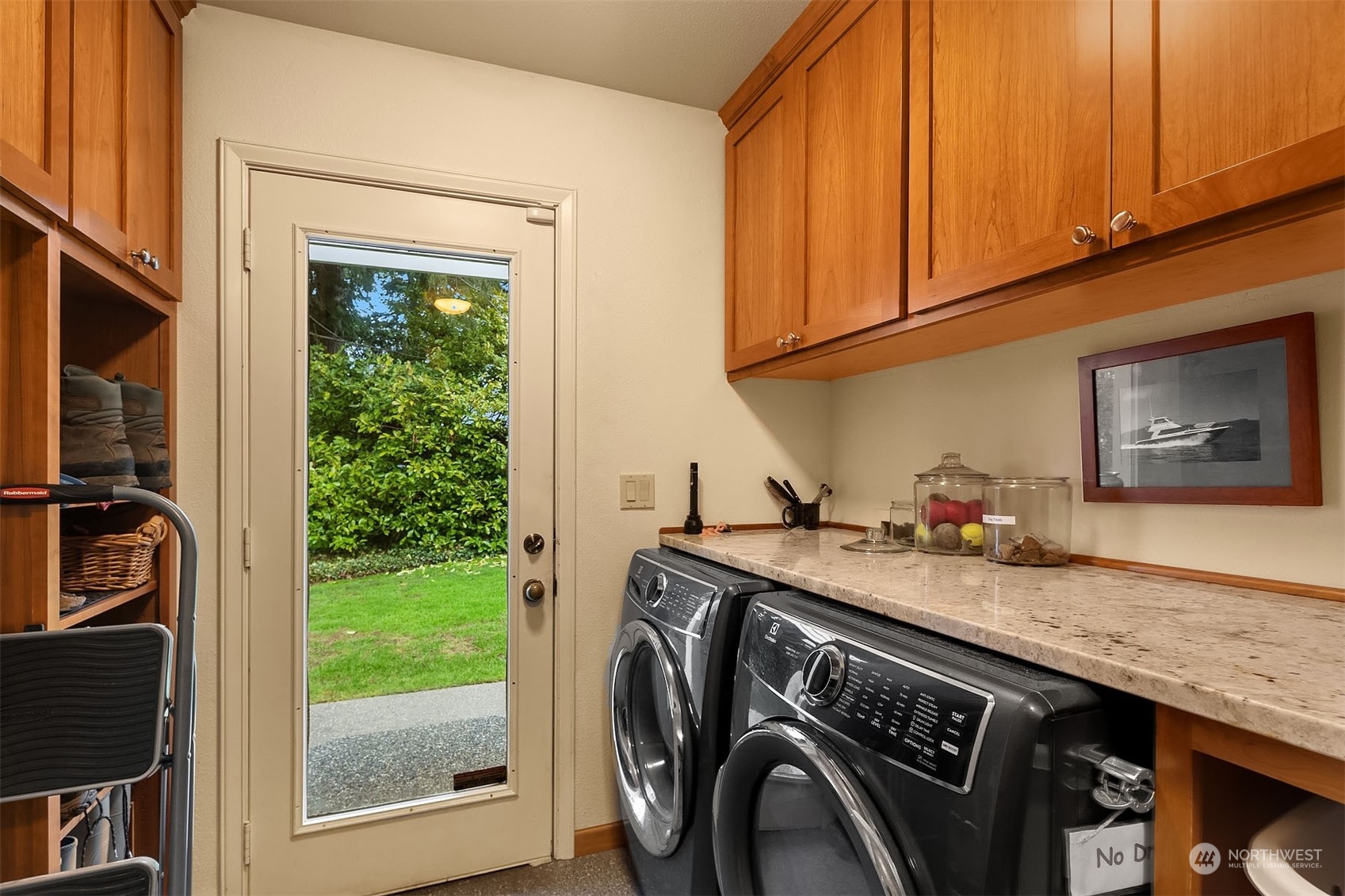 49 Strawberry Point Road Bellingham, WA 98229 - Photo 28 of 40 a utility room with granite countertop a sink a washer and dryer