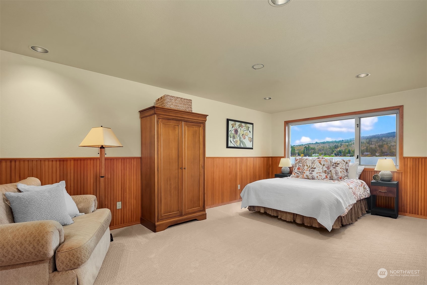 49 Strawberry Point Road Bellingham, WA 98229 - Photo 31 of 40 a bedroom with a bed and lamp