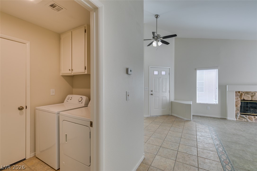 307 Cavalla Street Henderson, NV 89074 - Photo 32 of 44 Functional laundry appliances stand ready in a convenient, well-placed alcove just off the main living space.