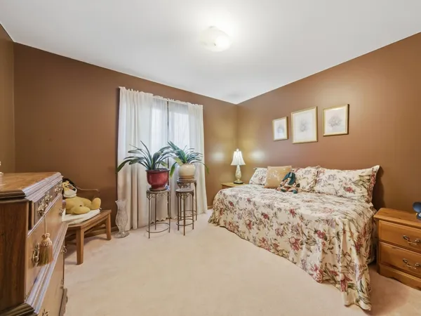 a bedroom with a bed and a table