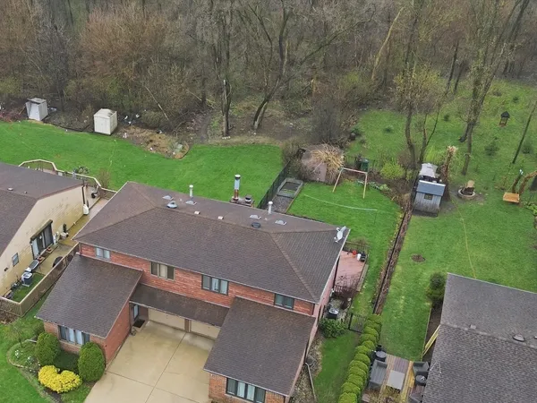 an aerial view of a house with a garden