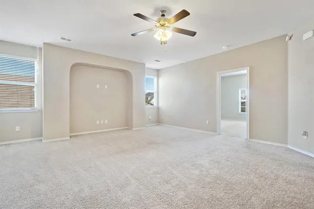 a view of an empty room with a window