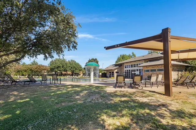 a front view of a building with garden