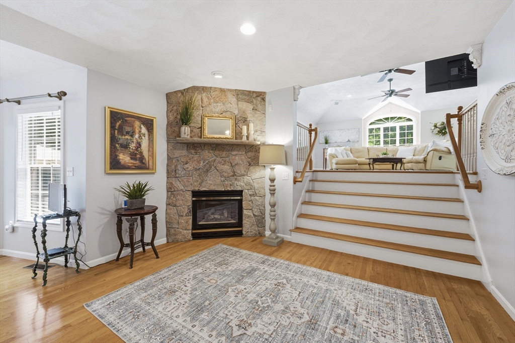 25 Haymeadow Road Boxford, MA 01921 - Photo 18 of 42 a living room with furniture and a fireplace
