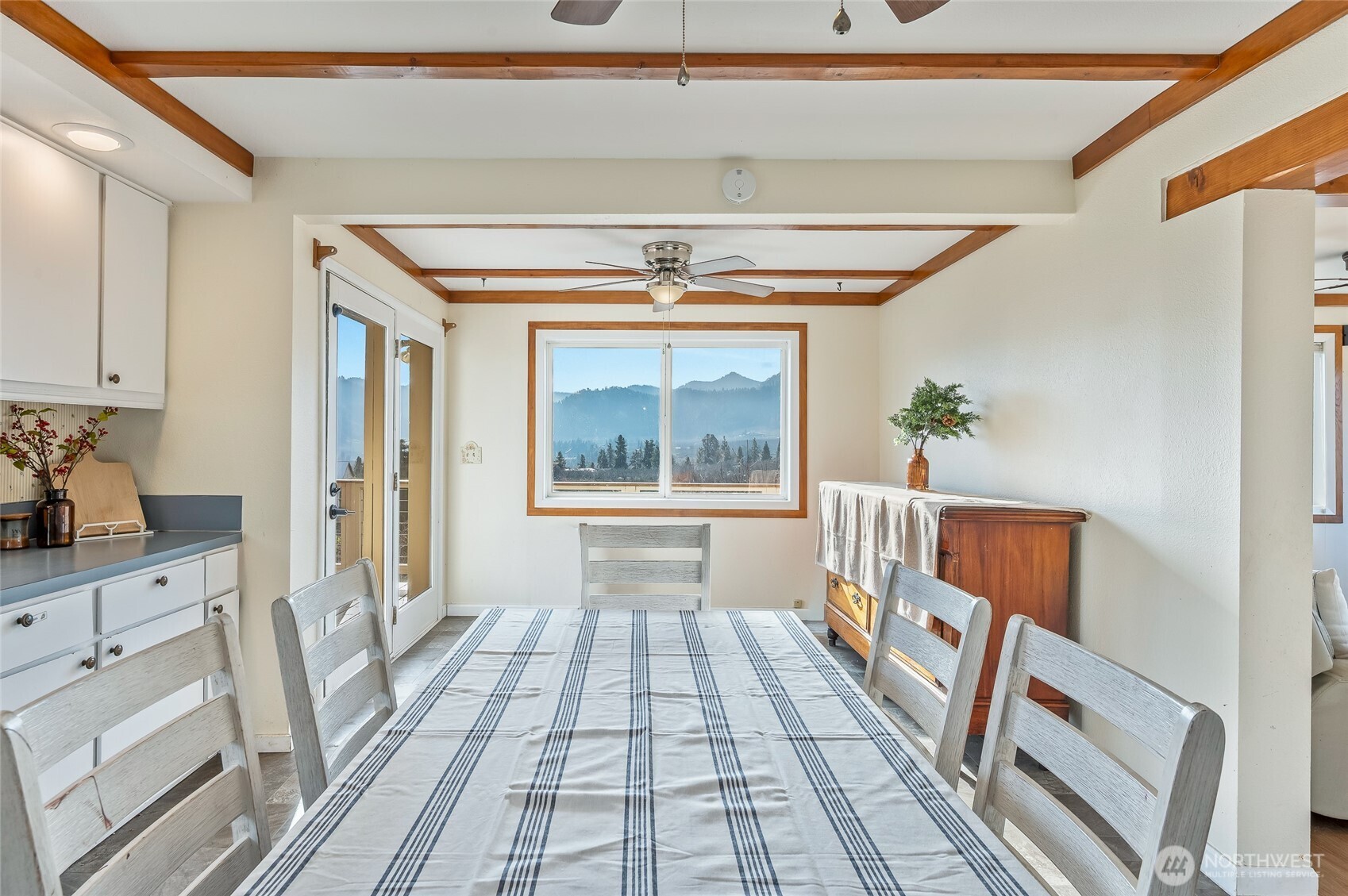 8133 North Dryden Road Cashmere, WA 98815 - Photo 15 of 36 a hallway with a baby crib furniture and a window