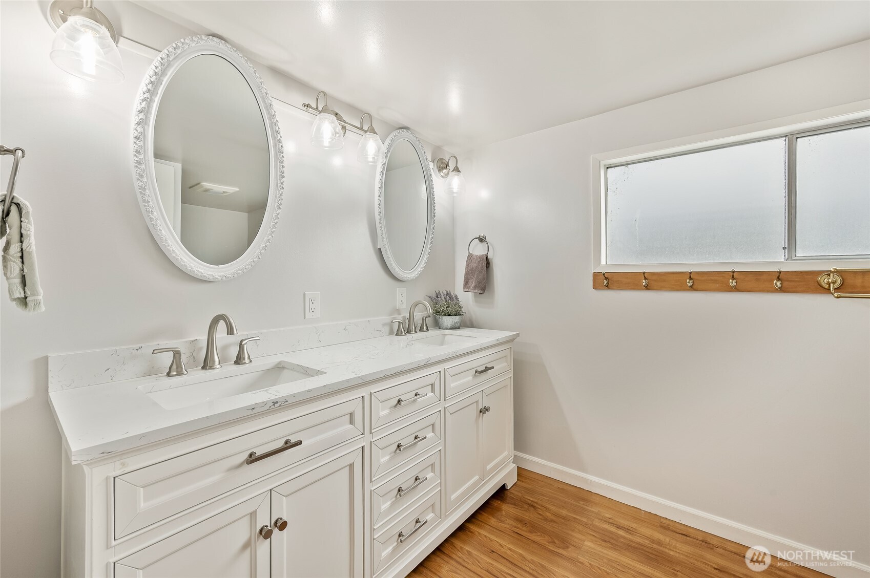 8133 North Dryden Road Cashmere, WA 98815 - Photo 20 of 36 a bathroom with a double vanity sink and a mirror