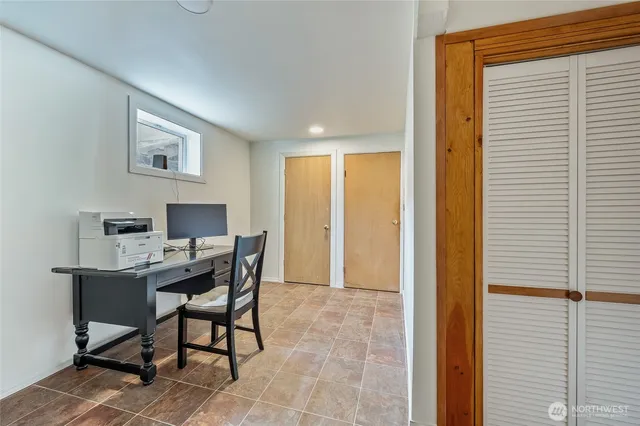 a workspace with furniture and a window