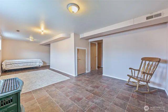a view of a livingroom with furniture and lounge chair