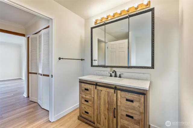 a bathroom with a sink and a mirror