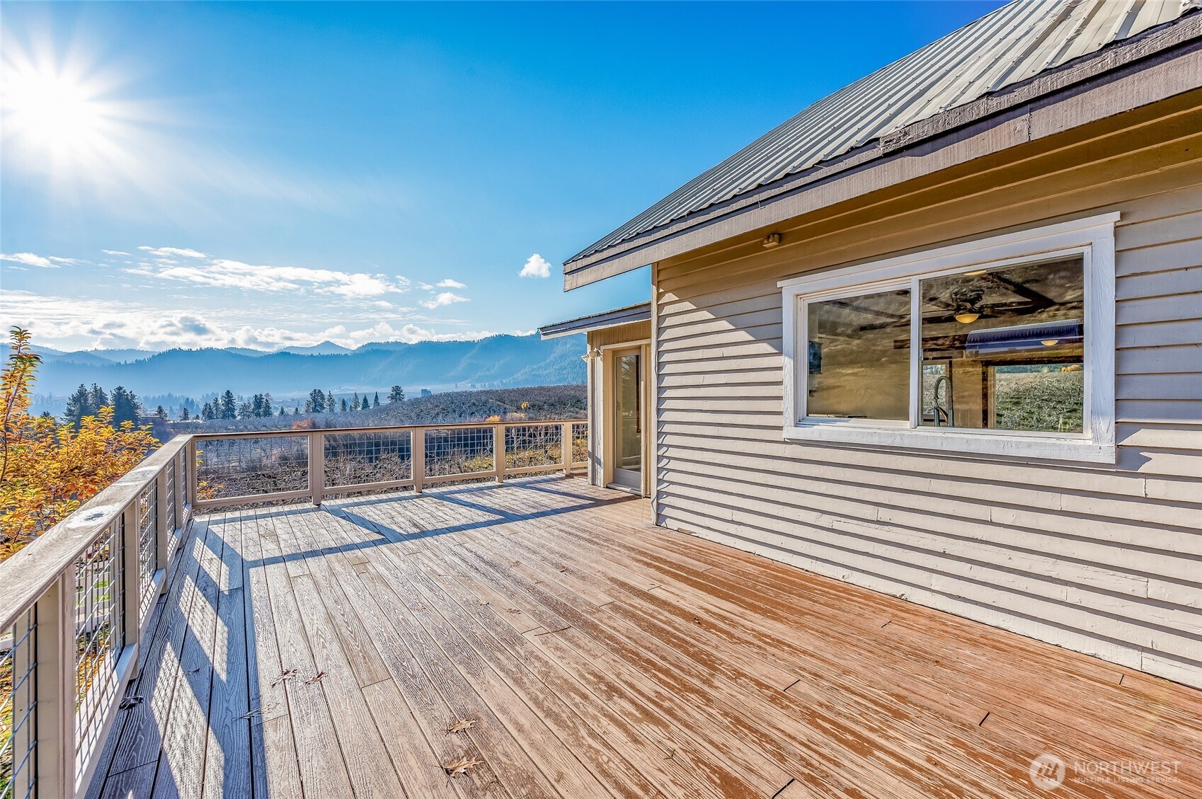 8133 North Dryden Road Cashmere, WA 98815 - Photo 4 of 36 a view of a house with a roof deck