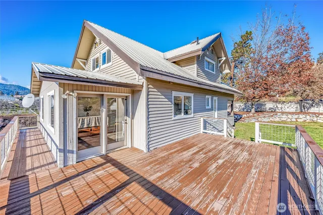 a view of house with a deck