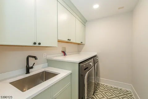 a kitchen with a sink and cabinets