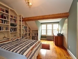 24 Fayette Street, Unit 24 Boston, MA 02116 - Photo 18 of 36 a bedroom with furniture and a book shelf
