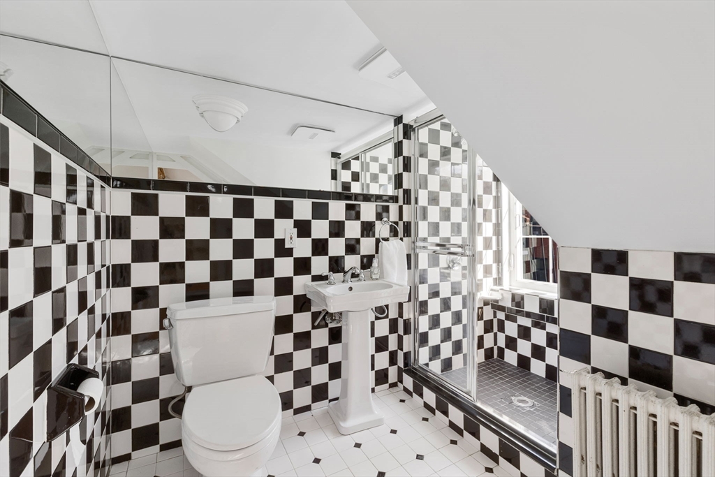 24 Fayette Street, Unit 24 Boston, MA 02116 - Photo 21 of 36 a bathroom with a black and white checkered floor