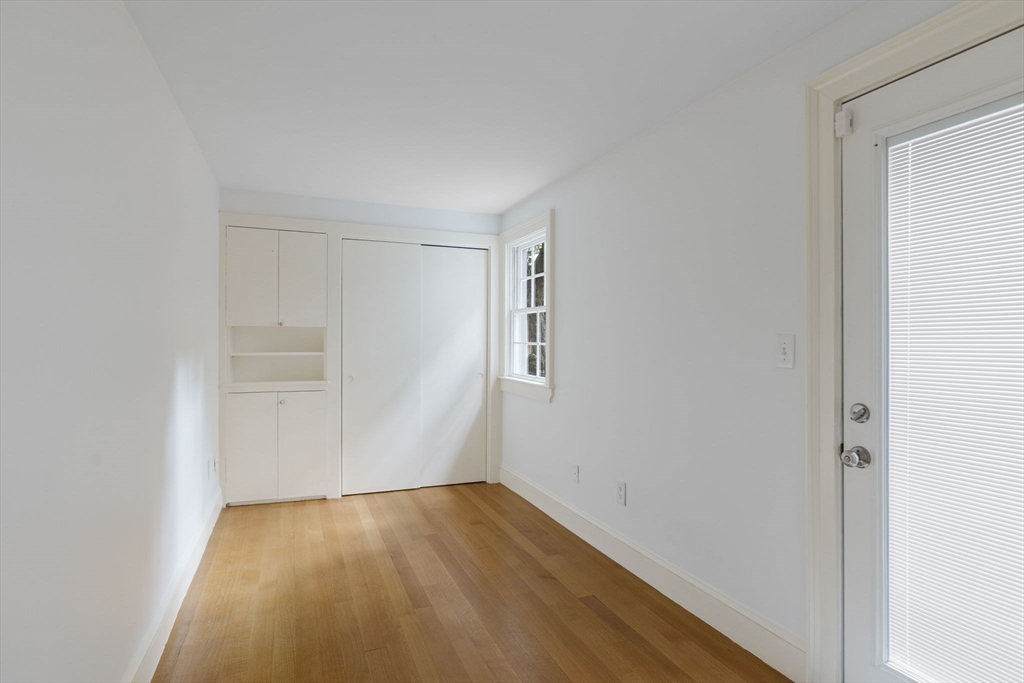 24 Fayette Street, Unit 24 Boston, MA 02116 - Photo 23 of 36 a view of a small space with wooden floor and a window