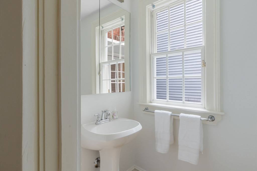 24 Fayette Street, Unit 24 Boston, MA 02116 - Photo 24 of 36 a bathroom with a sink and a mirror