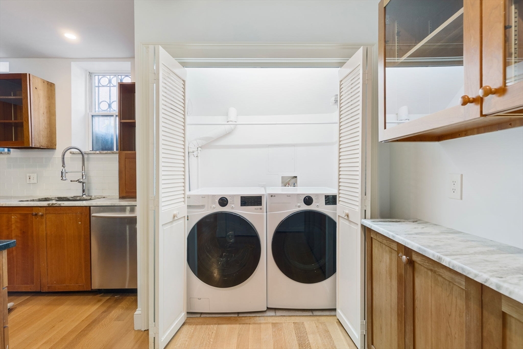 24 Fayette Street, Unit 24 Boston, MA 02116 - Photo 36 of 36 a view of kitchen with washer and dryer