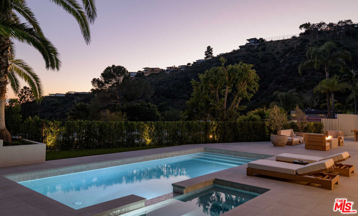 1718 Rising Glen Road Los Angeles, CA 90069 - Photo 15 of 19 a view of a backyard with lawn furniture