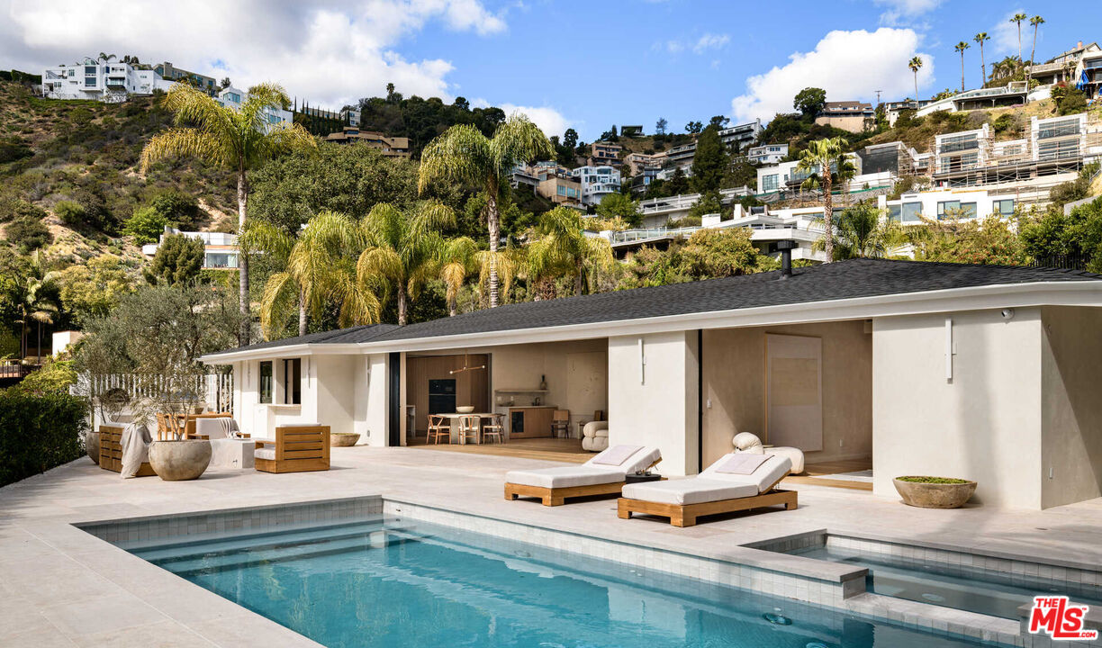1718 Rising Glen Road Los Angeles, CA 90069 - Photo 17 of 19 a view of the house with cars park