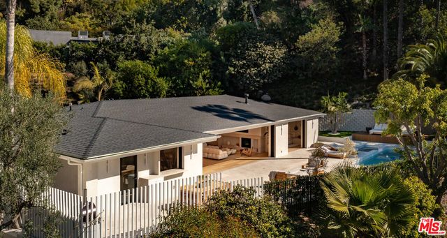 a view of a house with a small yard