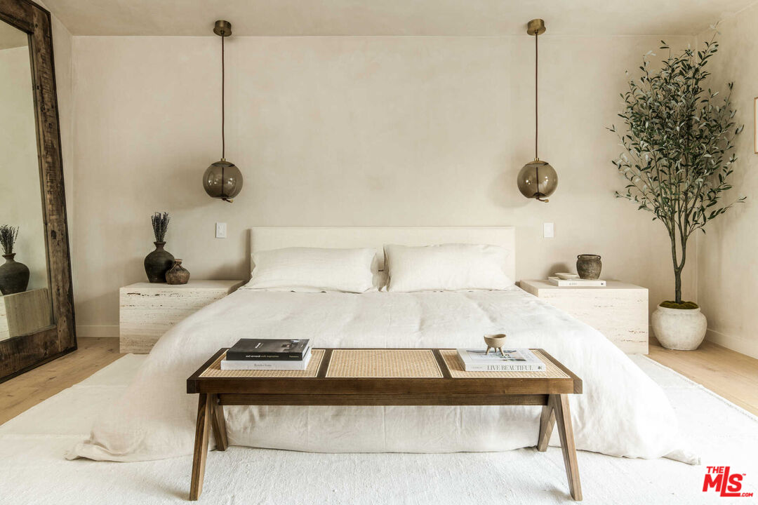 1718 Rising Glen Road Los Angeles, CA 90069 - Photo 7 of 19 a bedroom with a bed and a potted plant