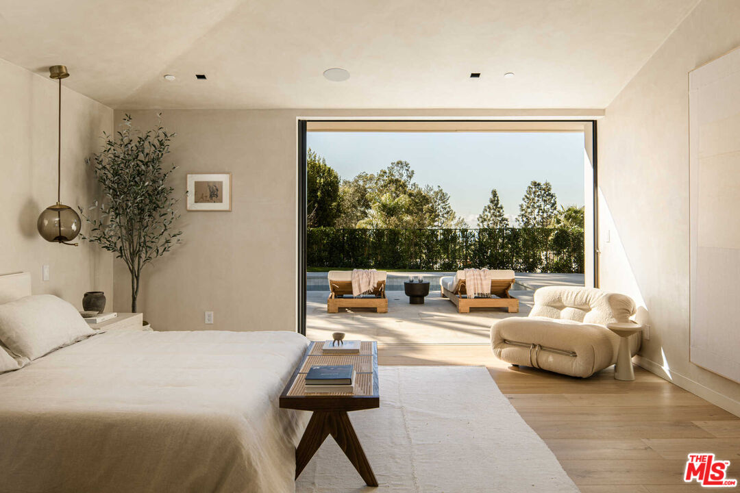 1718 Rising Glen Road Los Angeles, CA 90069 - Photo 8 of 19 a bedroom with furniture and a large window