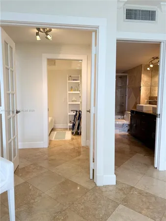 a bathroom with a sink a toilet and bathtub