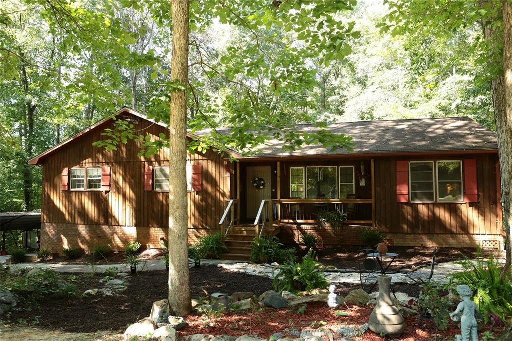 3350 Hunt Road Acworth, GA 30102 - Photo 1 of 1 Ranch style home situated on a large private lot with a bubbling stream