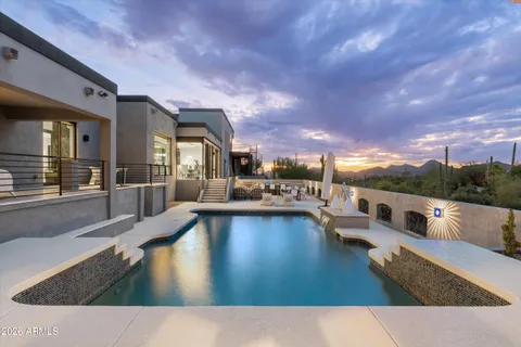 a swimming pool with outdoor seating and livingroom view