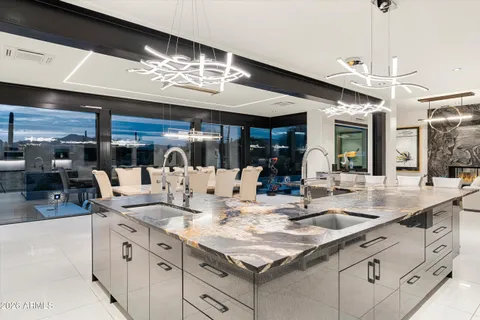 a large white kitchen with cabinets