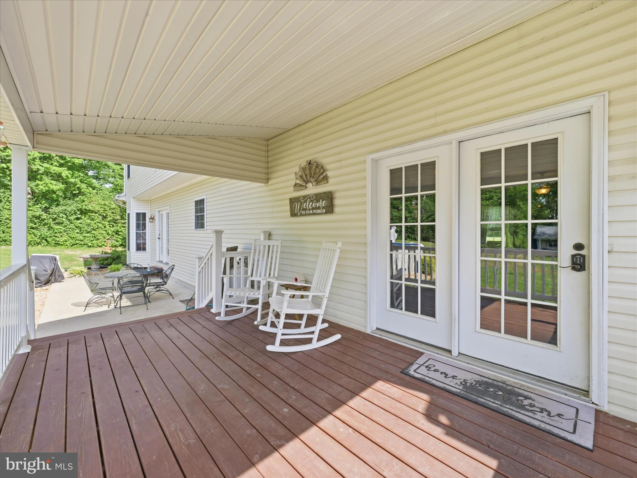 726 Doe Run Road Inwood, WV 25428 - Photo 14 of 68 a view of a deck with wooden floor and yard
