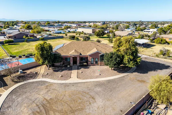 an aerial view of residential houses with outdoor space